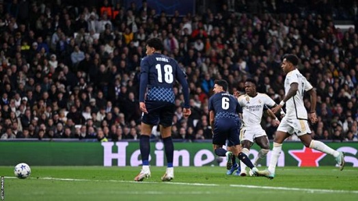 Vinicius Jr scored and assisted as Real Madrid advanced to the knockout stages