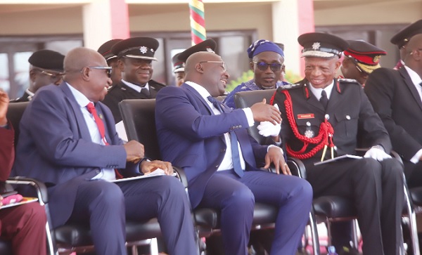Vice-President Dr Mahamudu Bawumia (2nd from left) interacting with Julius A. Kuunuor (right), Chief Fire Officer, during the Cadet Course 23 graduation ceremony. With them is Ambrose Dery (left), Minister for the Interior. Picture: SAMUEL TEI ADANO