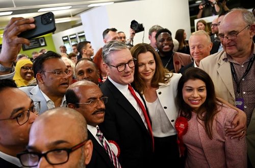 Keir Starmer and his wife, Victoria, are greeted at his constituency count at Holborn and St Pancras.