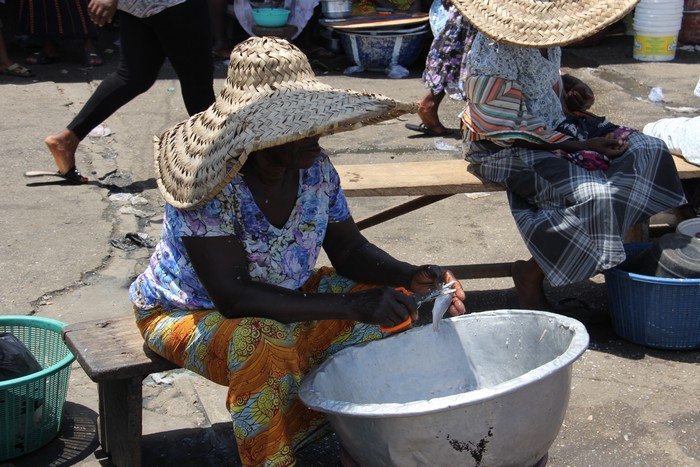 we sit around here hoping to assist market women with their goods for some money