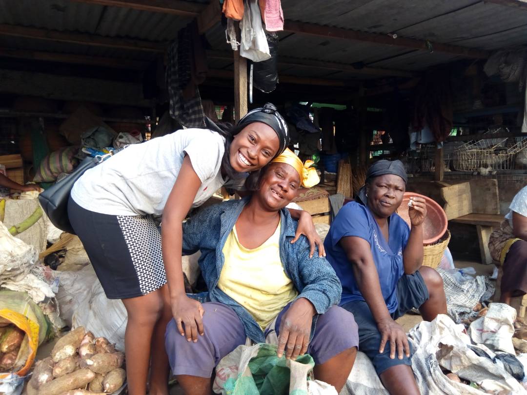 Elselund interacting with market women while shopping for clients
