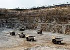 A drone view shows queued dump trucks at Gold Fields Mine in Tarkwa