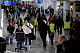 Travelers walk through Newark Liberty International Airport during the week of Thanksgiving in Newark, New Jersey, U.S.